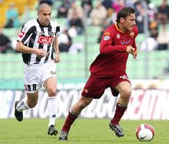 Totti in action against Udinese ...