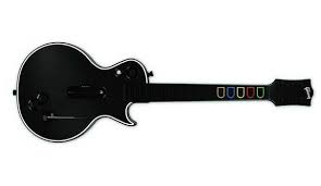 http://tbn1.google.com/images?q=tbn:kswlahvczH9hBM:media.obsessable.com/media/2008/11/12/575/les-paul-playstation-3-wireless-guitar-hero-3-controller.jpg