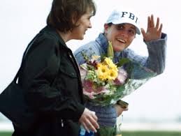 Anne Sluti waves to friends,
